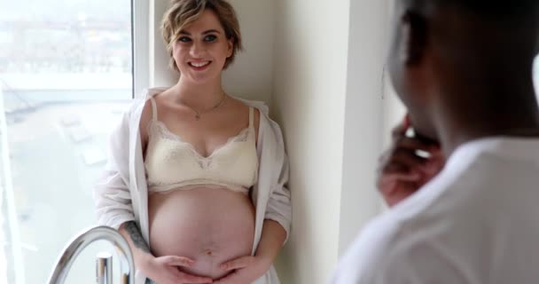 Young Happy Caucasian Pregnant Woman Stands Touches Her Belly Next — Stock Video