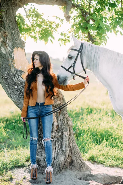 Young Happy Woman Stands Unbuttoned Jacket Tree Holds White Horse — Stock Photo, Image