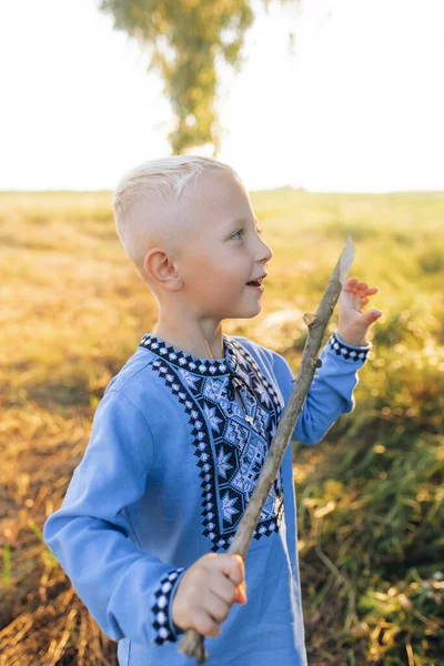 Happy Child Boy Has Fun Plays Meadow Wooden Stick Dressed — Stockfoto