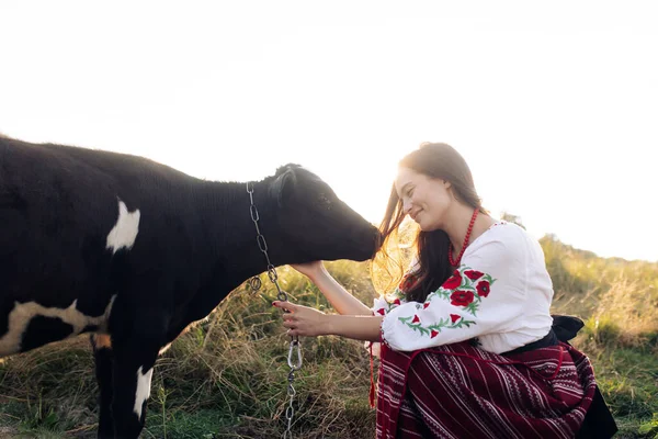 Young Ukrainian Woman Sits Smiles Holds Calf Dressed Traditional National — 스톡 사진