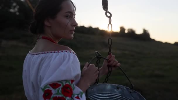 Young Ukrainian Woman Stands Traditional National Embroidered Shirt Bucket Chain — Stock video