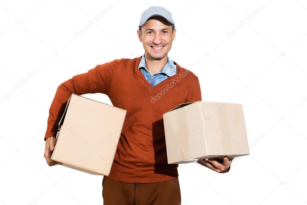 Cheerful delivery man. Happy young courier holding a cardboard box and smiling while standing against white background