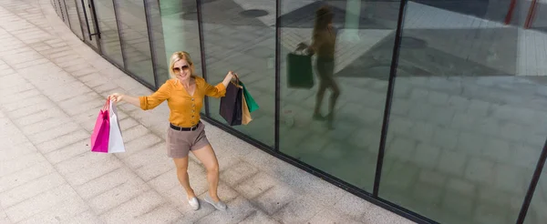 Happy woman shopping for clothes