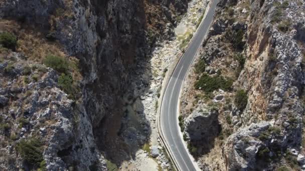 Empty rural road through the beautiful gorge of Kourtaliotikos in Crete Island in Greece. — Stock Video