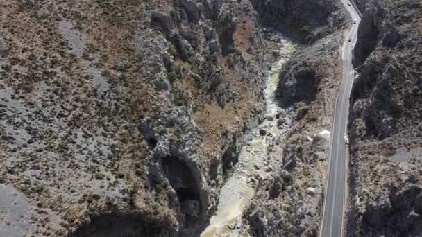 Empty rural road through the beautiful gorge of Kourtaliotikos in Crete Island in Greece. — Stock Video