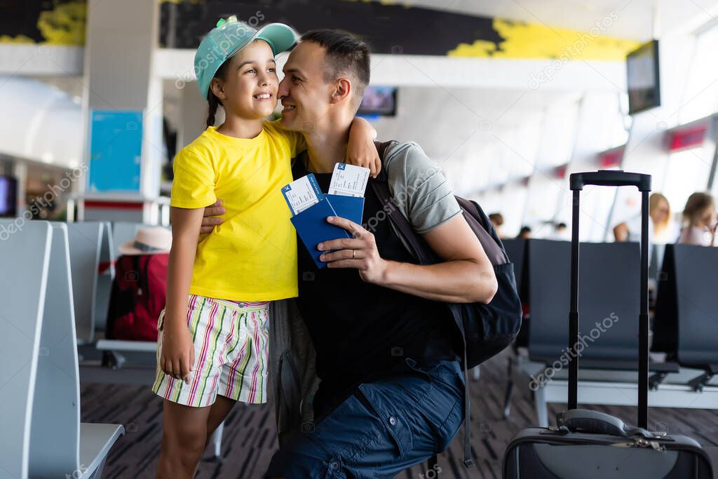 Young father with daughter at the airport