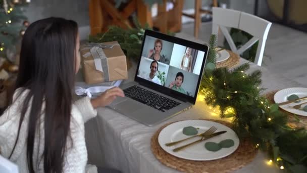 Happy little girl on videocall with parents and family during Christmas vacation - kid celebrating Xmas eve online in virtual chat meeting conference — Stockvideo