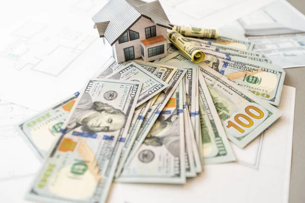 Mortgage, investment, real estate and property concept. close up of home model, Thai money and house keys Stock Photo