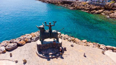 August 25 2021 - The statue of Europe is sitting on a bull. Sculpture of Europe, mother of King Minos, riding a bull in Agios Nikolaos, Crete, Greece.