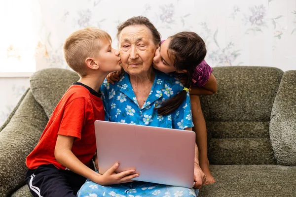 Children and a very old great-grandmother — Stock Photo, Image