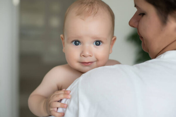 happy mother holding her baby