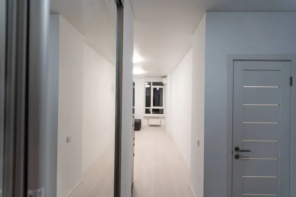 empty corridor in interior of entrance hall of modern apartments.