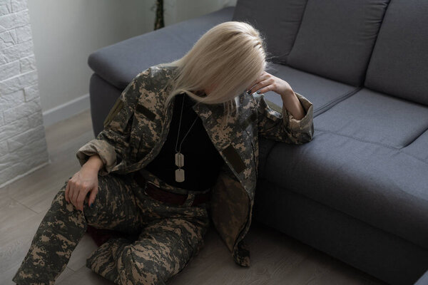 A female soldier, sad military woman