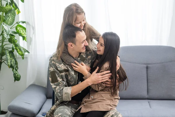 Happy military father and two daughters at home. — Stock Photo, Image