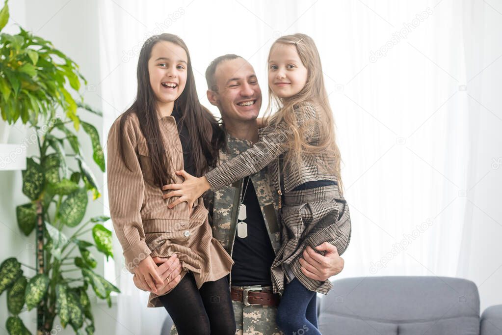 beautiful little daughters and military father at home