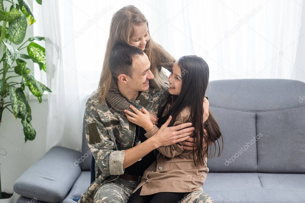 Happy military father and two daughters at home.