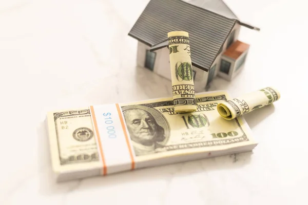Stack of dollars as a Foundation to a house. — Stock Photo, Image
