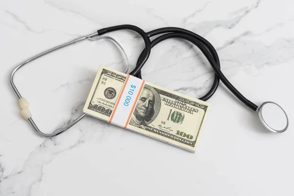 Concept of economy crisis and recession in USA during coronavirus or covid-19 pandemic, US dollars, stethoscope and background copy space — Stock Photo, Image