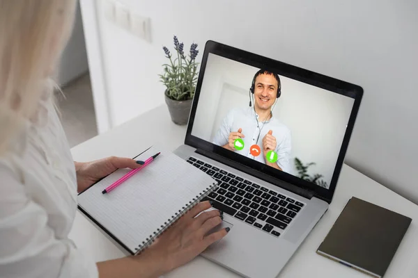 Caucasian female teacher using computer and laptop on video call with school children. Online education staying at home in self isolation during quarantine lockdown. — Stock Photo, Image