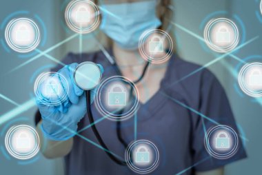 Tanımlanamayan tıp doktoru bir bilgisayar ağı üzerinden birçok cihazdan hastanın tıbbi kayıtlarını alıyor. Sağlık bilgi alışverişi ve veri gizliliği için sağlık hizmetleri bilişim kavramı.