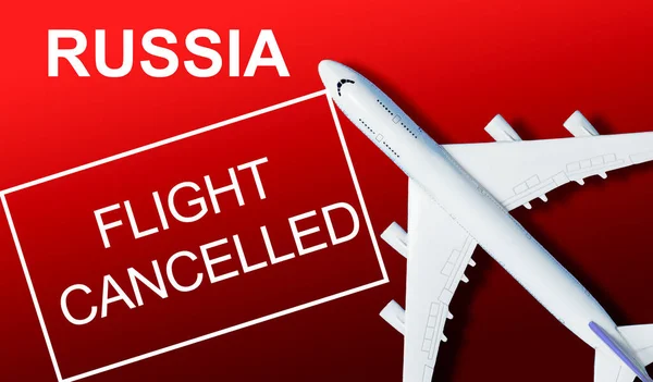 No travel by plane closed sky because of war conflict between Russian and Ukraine paper plane with russian and ukrainian flag — Stock Photo, Image