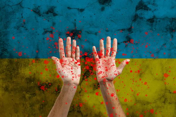 Hand Ukrainas flagga och blod. Inget krig och fred koncept. — Stockfoto
