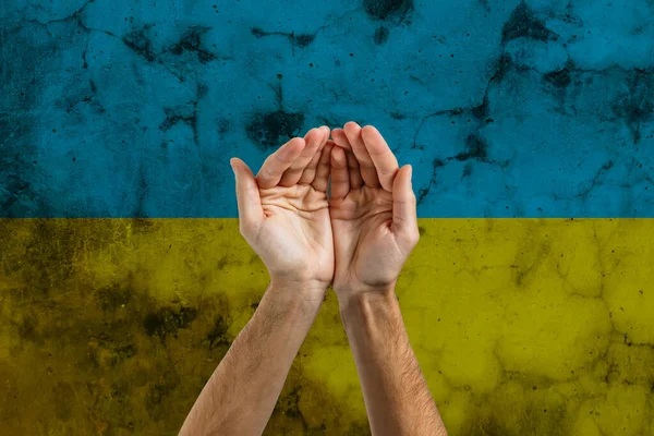 Hand of the flag of Ukraine and blood. No war and peace concept. — Stock Photo, Image