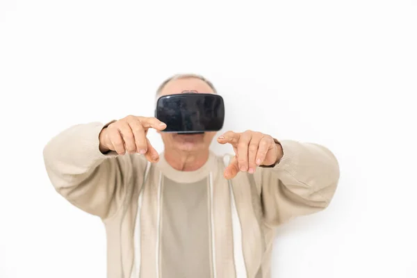 Senior man playing video game on white background — Stock Photo, Image
