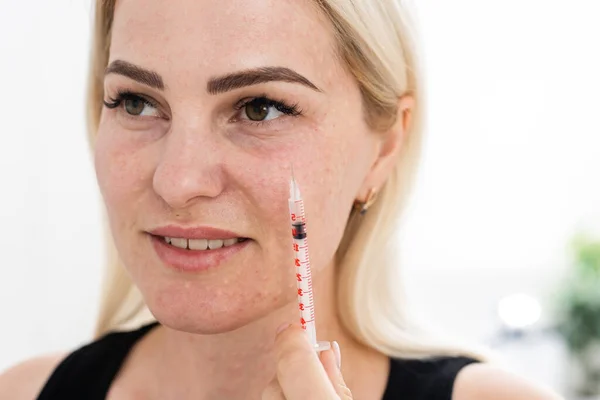 Mesotherapy in the neck and chest-neckline. Traces of hyaluronic acid injections. Light background — Stock Photo, Image