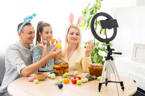 Family call on the phone in the kitchen decorated for Easter. Easter — Stockfoto