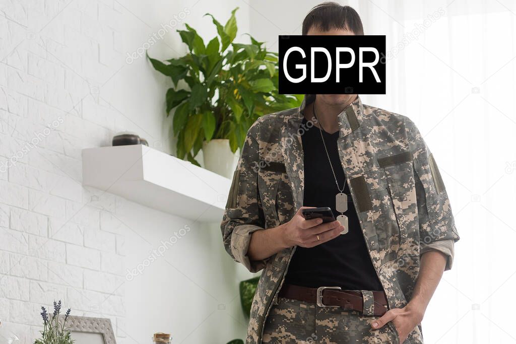 GDPR - General Data Protection Regulations Military concept. Soldier offers a padlock with gdpr word surrounded stars. European Data Security System.