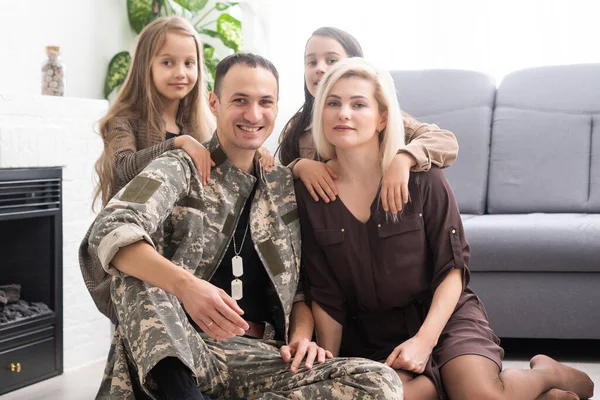 Joyful happy military man with his wife and two kids. Family togetherness and support concept — Stock Photo, Image