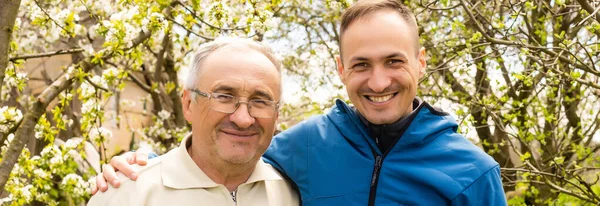 Portrait of happy father and son, which are similar in appearance — Stock Photo, Image