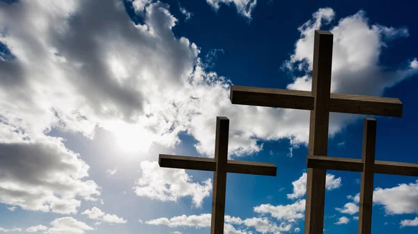 Jesus Christ cross. Easter, resurrection concept. Christian wooden cross on a background with dramatic lighting, colorful mountain sunset, dark clouds and sky, sunbeams. — Stock Photo, Image