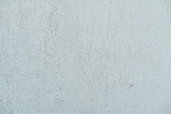 Patrón de yeso decorativo y texturizado beige claro. Materiales de construcción y acabado para la reparación de paredes en apartamentos, casas y oficinas. Fondo y textura para el diseño y la decoración — Foto de Stock