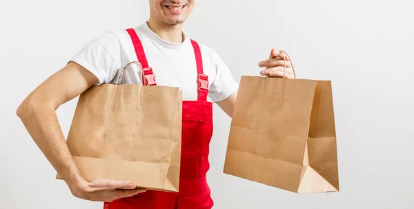 Diverse of paper containers for takeaway food. Delivery man is carrying — Stock Photo, Image