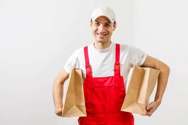 Muž s balíčky dodávek potravin — Stock fotografie