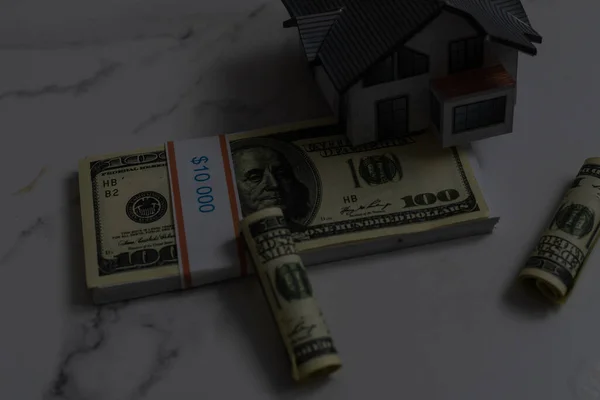 Miniature toy house and money. — Stock Photo, Image