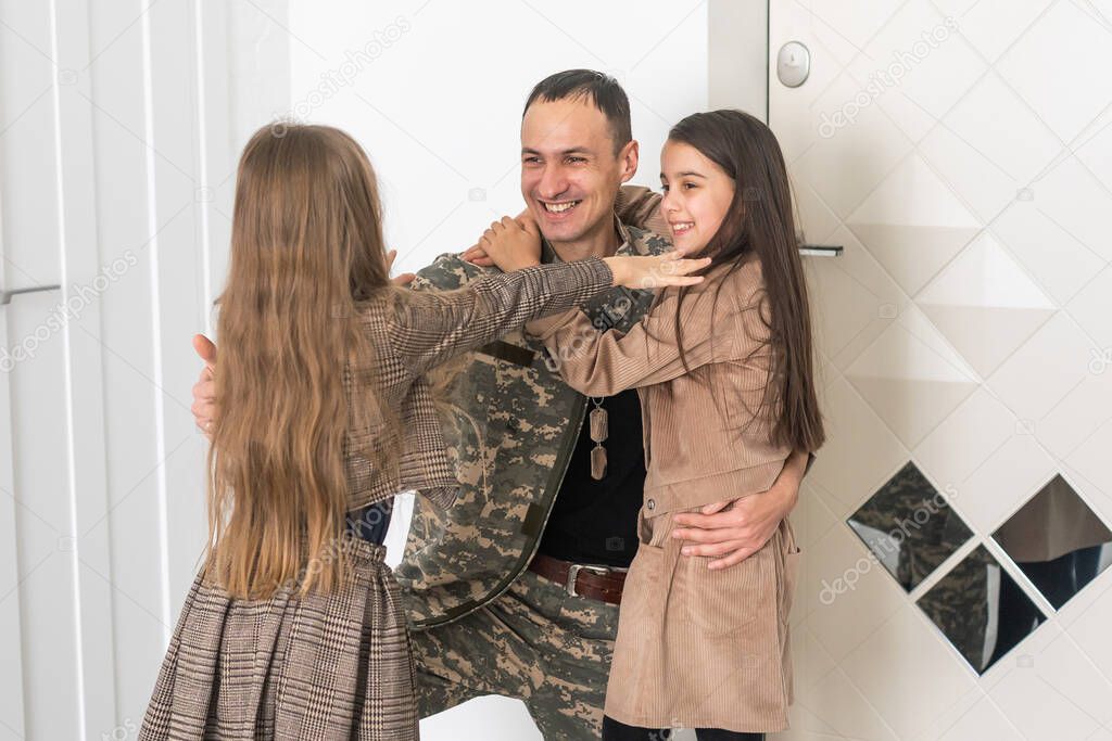 beautiful little daughters and military father at home