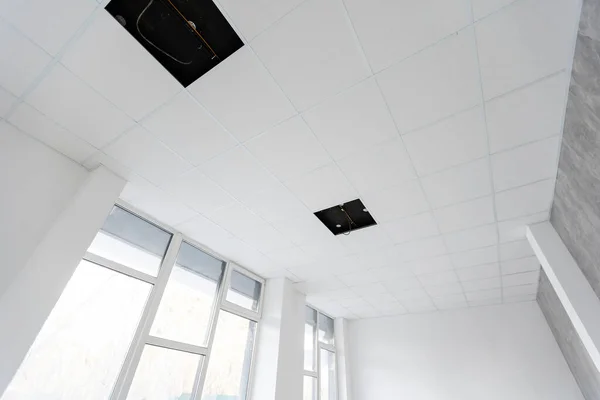 Ceiling and lighting inside office building.