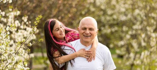 Grandfather And granddaughter on flower farm — 스톡 사진