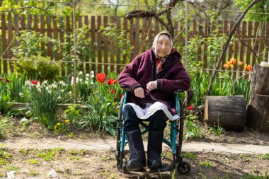 very old woman in a wheelchair