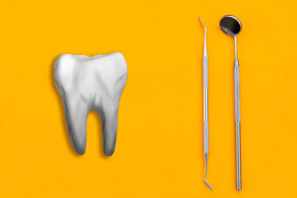 Diente artificial e instrumento dental en la mesa. Concepto de servicios dentales — Foto de Stock