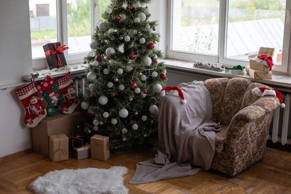 Christmas, New Year interior, decorated fir tree with garlands and balls.