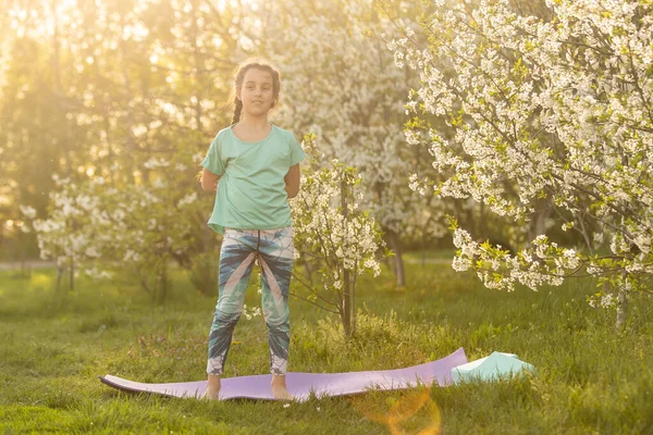 Little Girl Child Doing Yoga Exercise Stretching Grass Sunny Summer — Stock Fotó