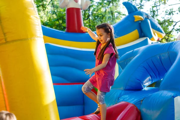 Cheerful Child Plays Inflatable Castle — ストック写真