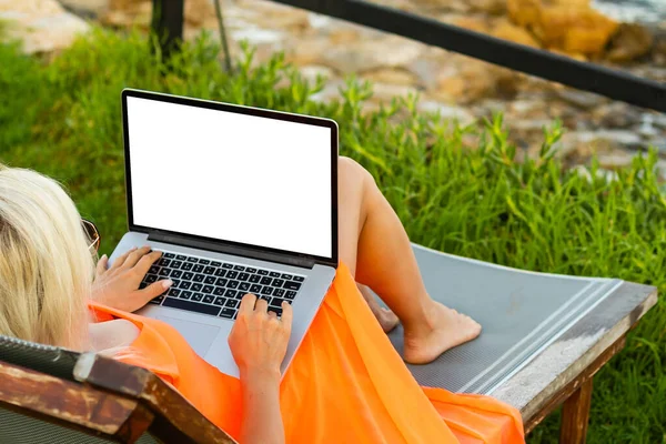 woman watching video course, distance e-learning, studying with online teacher by webcam. Remote education, work from home concept. Over shoulder close up laptop mock up screen view