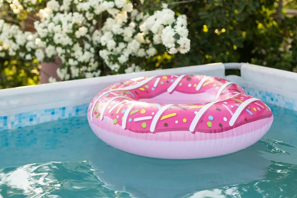 Childrens inflatable pool with toys.