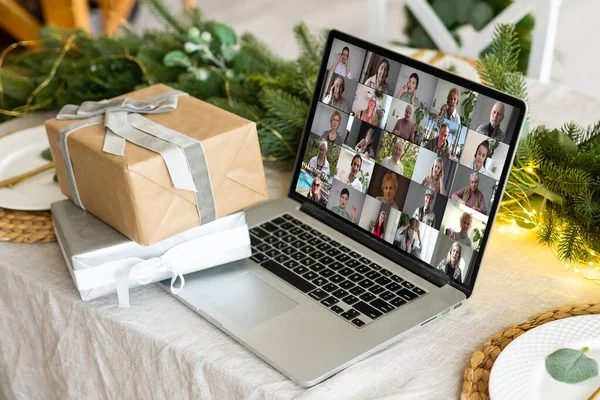 Virtual Christmas tree meeting team teleworking. Family video call remote conference. Laptop webcam screen view. Team meet working from their home offices. party online.