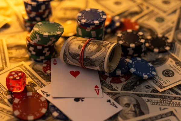 Poker cards royal flush, cash money dollar bills. Gambling, casino chips, dices. Casino tokens, gaming chips, checks, or cheques on green table in casino club.